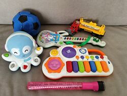 Игрушки разные пакетом синтезатор, осьминожек, гитара, мячик, машинка 