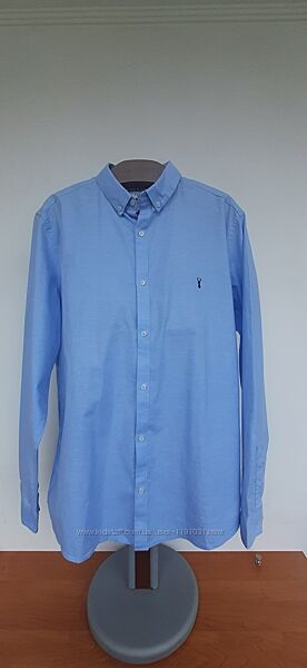 Блакитна приталена сорочка Некст