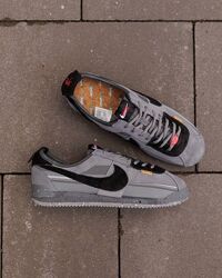 p. 43  Nike Cortez UN/LA Grey Black NK254