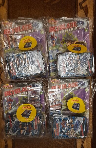 Журнал з бустером по 8 карточек та жестяним боксомБЕЙБЛЕЙД BEYBLADE