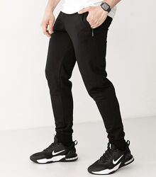 Спортивні штани на манжетах, кишені на застібках