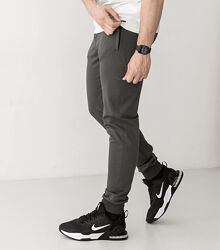 Спортивні штани на манжетах, кишені на застібках