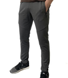 Спортивні штани на манжетах, кишені на застібках