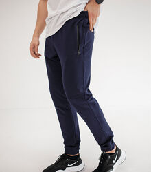 Спортивні штани на манжетах, кишені на застібках