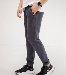 Спортивні штани на манжетах, кишені на застібках