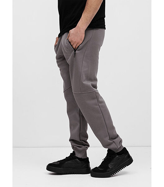 Теплі спортивні штани різані з карманами на застібках