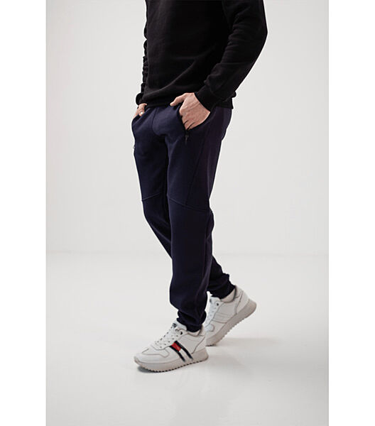 Теплі спортивні штани різані з карманами на застібках