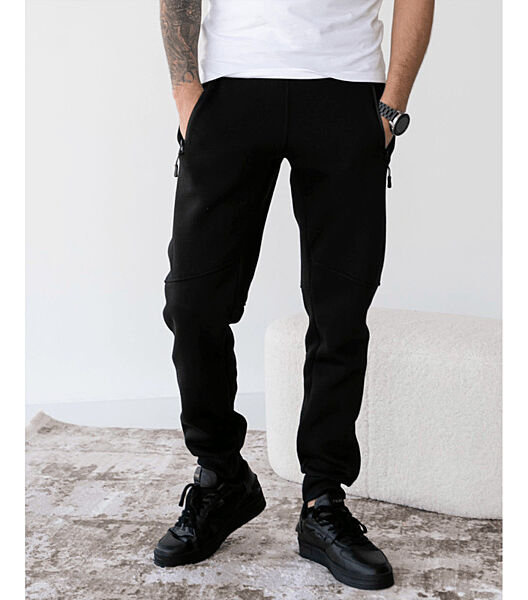 Теплі спортивні штани різані з карманами на застібках