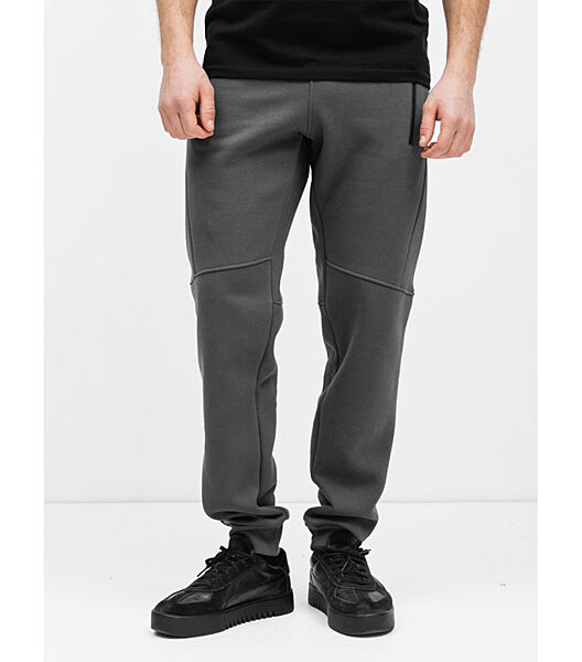 Теплі спортивні штани різані з карманами на застібках