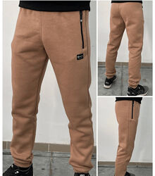 Теплі спортивні штани на манжетах